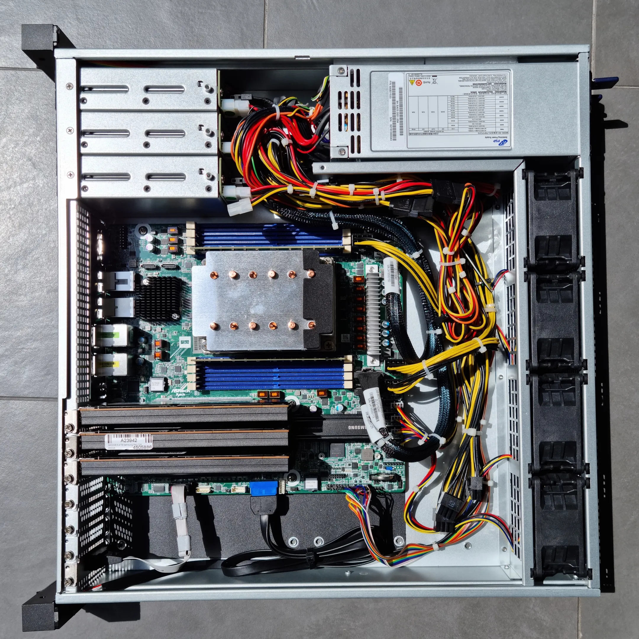 Internal layout of the Innovision M24306 case with an ASRock Rack ALTRAD8UD-1L2T motherboard and an Ampere Altra Q64-22 CPU.